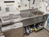 a kitchen with a sink, dishwasher, and dishwasher