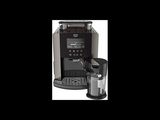 the coffee maker is next to a cup of coffee on the table