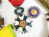 a group of medals on a table with other items