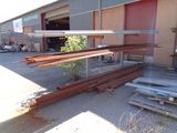 many pieces of wood that are sitting outside of a building