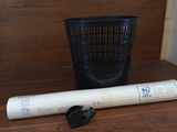 a baseball bat and a baseball bat holder on a shelf