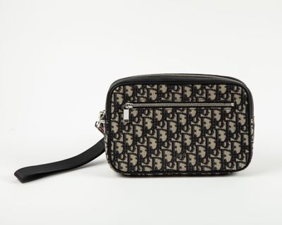 a black and white cross body bag on a white background