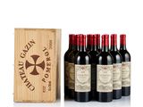 six bottles of red wine in a wooden box with a wooden box