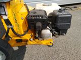a small engine on the back of a small machine