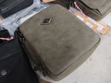 several pieces of luggage sitting on top of a pile of boxes