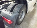 a truck with a flat tire parked in a garage
