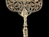 an ornate silver fan with a handle and a handle
