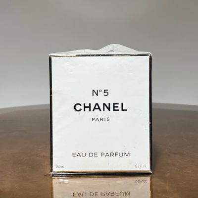a close up of a box of perfume on a table