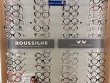 many pairs of glasses on display in the store