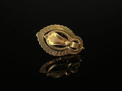 BROCHE en or 750/°°° (18k), à motifs de boules et d'enroulem… - Photo 1