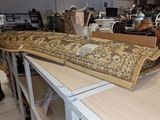 a large rug on top of a table in a room