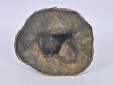 a small piece of stone with a hole in it
