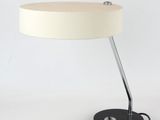a white lamp that is sitting on a table