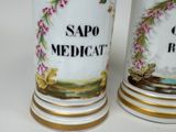 two vases that have been decorated with flowers on them