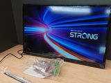 a tv that is sitting on a table with a remote