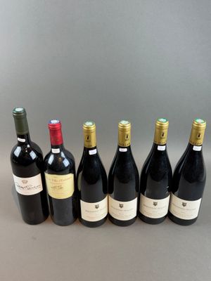 six bottles of wine are lined up in a row on a table