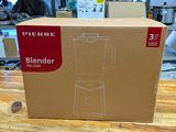 a box that has a blender in it on a table