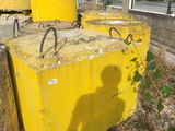 a man that is standing in front of some yellow boxes