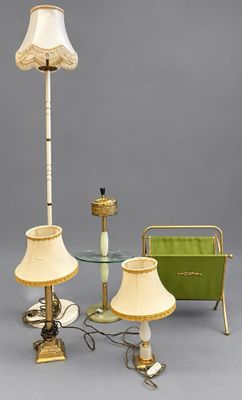 three lamps and a table with a lamp shade on it