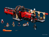 a lego train that is on the tracks with people around it
