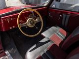a red car with a wooden steering wheel and a black seat