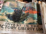 woman holding up a newspaper with a picture of a boat on it