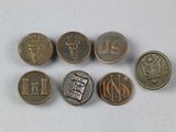 several coins with the names of different countries on them