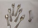 a lot of silver spoons and spoon spoons on the table