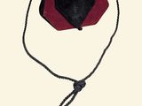 an image of a small purse with a string around it