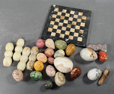 a chess board and some rocks on a table