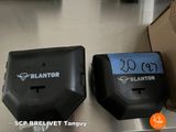 two bins that are sitting on a metal table