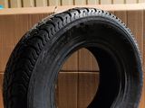 a tire that is sitting on the floor next to a box