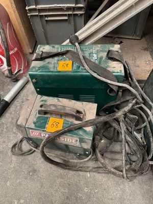an image of a couple of tools sitting on top of a pile of junk