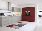 an image of a modern kitchen with white floors and red cabinets