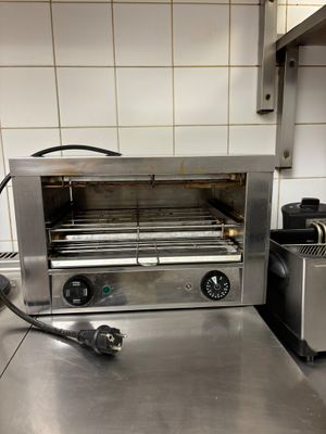 a toaster that is sitting on a counter in a kitchen