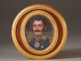 portrait of a man in a military uniform in a gold frame