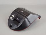 a black and red computer mouse on a white surface