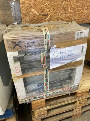 a stack of pallets that are sitting on a pallet in a warehouse