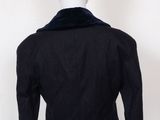 the back view of a black jacket with a fur collar on a mannequin mannequin mannequin mannequin mannequin mannequin mann