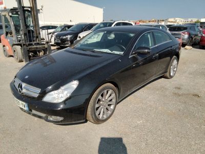 a black car that is parked in a parking lot