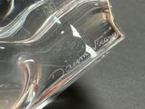 a close up of a clear glass object on a table