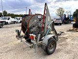 an image of a trailer with a large reel attached to it