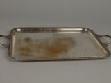 a silver tray with handles and handles