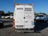a white van that is parked in a parking lot