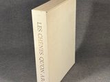 the book is sitting on a table with a gray background