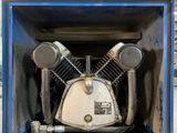 a blue box with an air compressor inside of it