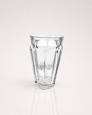 a clear glass cup sitting on top of a table
