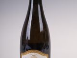 a bottle of wine that is sitting on a table