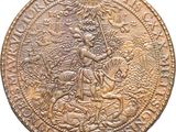a close up of a coin with a man on a horse