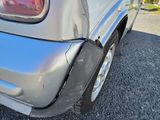 a close up of the rear end of a silver van